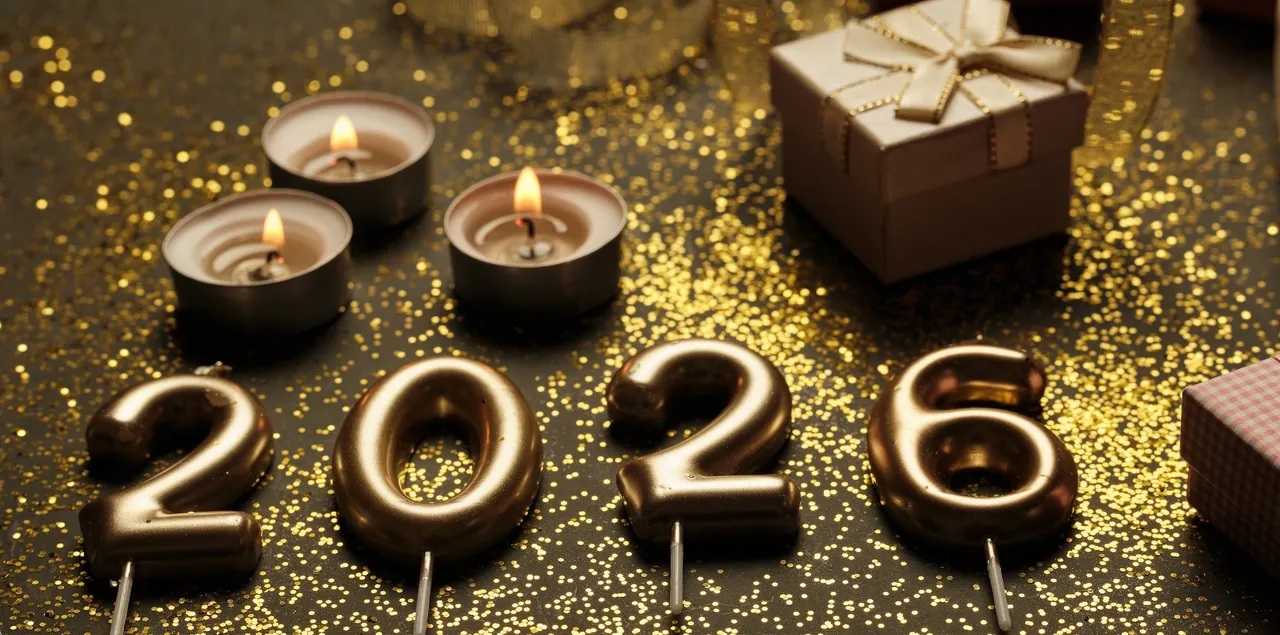Gold 2026 candles with festive decorations