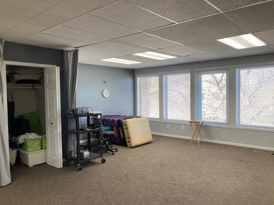 Spacious room with carpet flooring