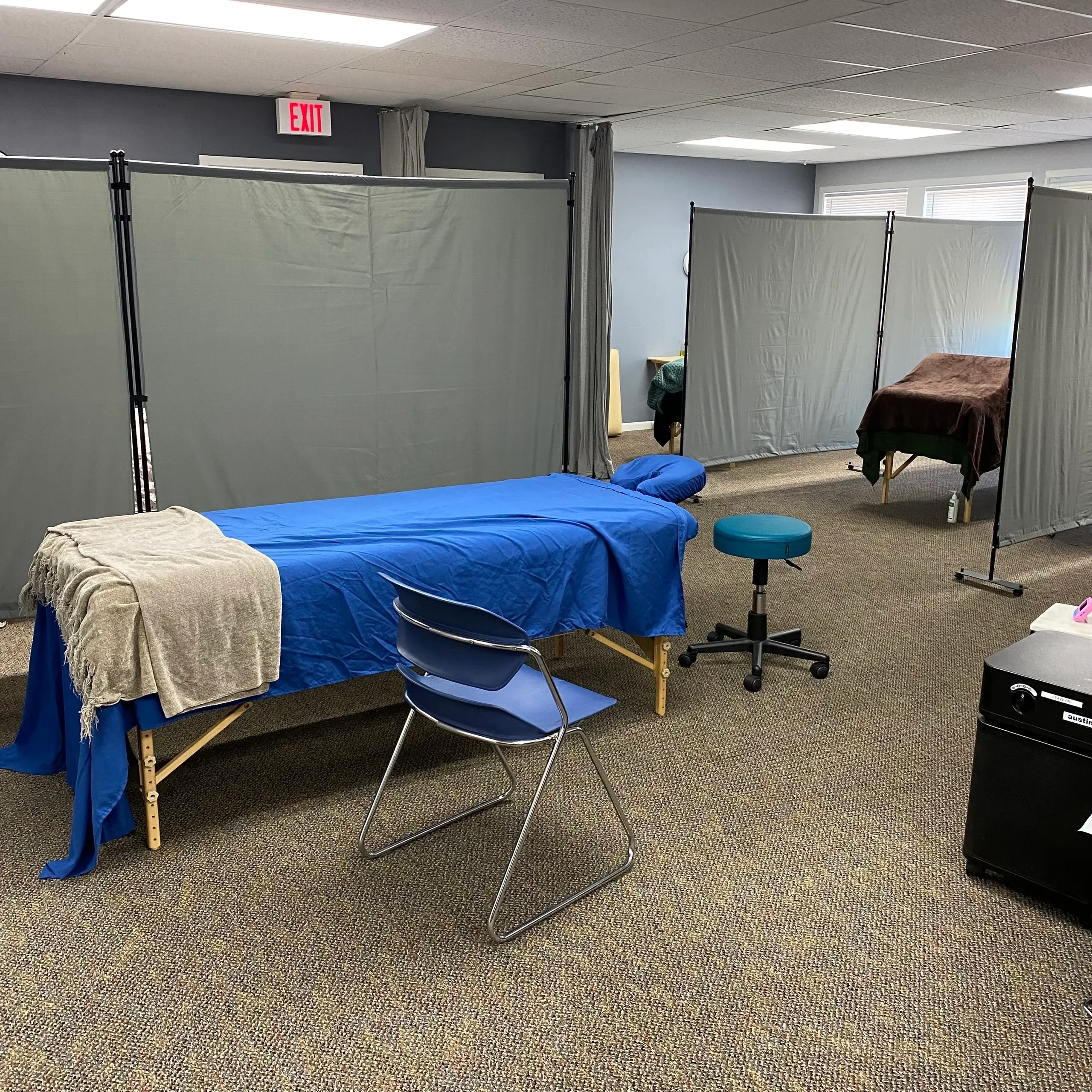 Massage therapy room with treatment tables
